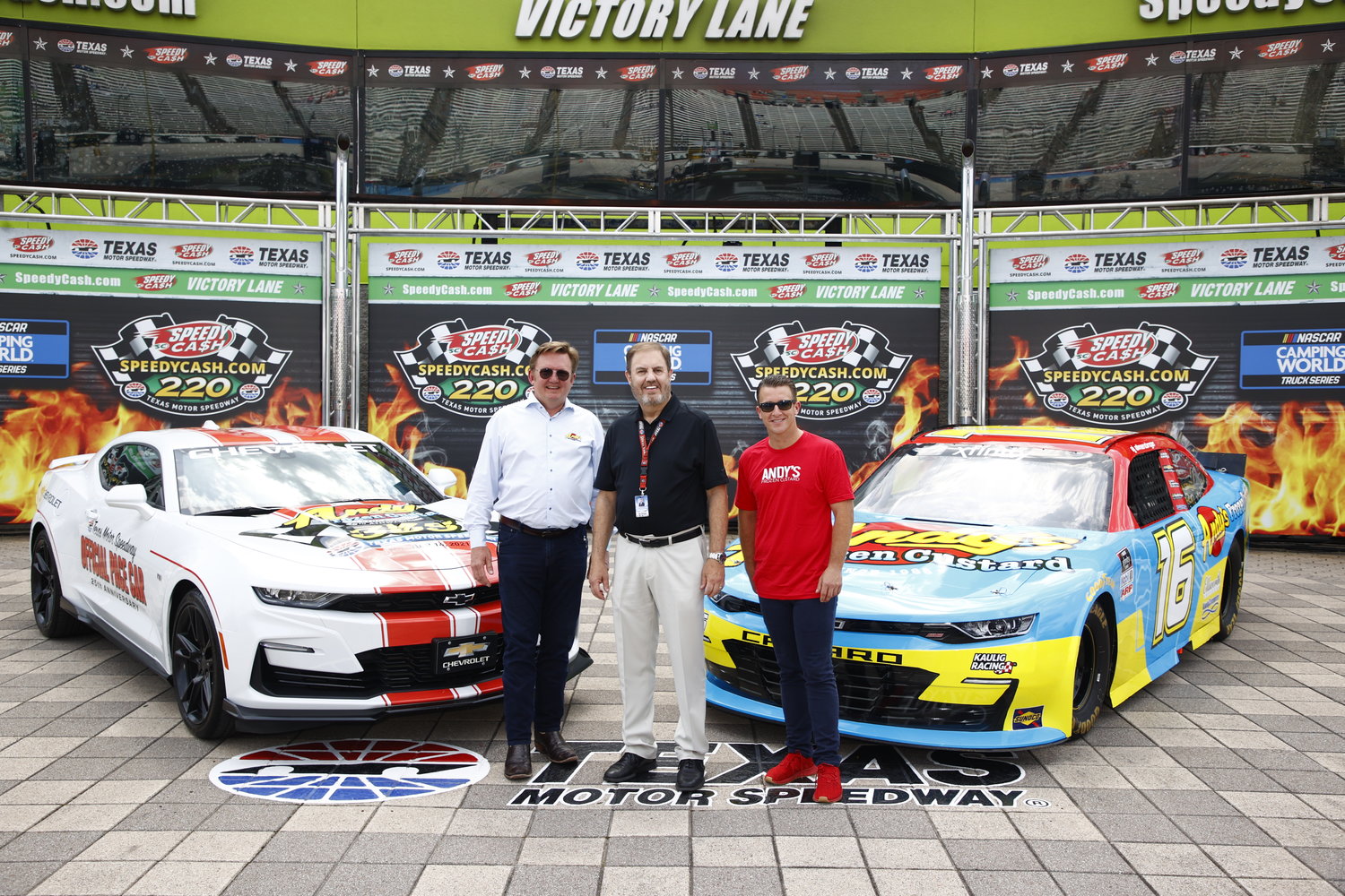 Andy’s President Andy Kuntz, left, GM Texas Motor Speedway President Eddie Gossage, and Andy’s title sponsor NASCAR driver AJ Allmendinger unveil the design for the No. 16 Andy’s Frozen Custard Chevy.